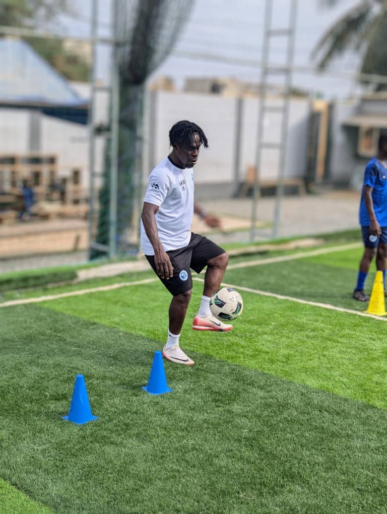 Coach demonstrating ball control